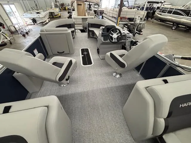 Slide: The Image of 2025 Harris Cruiser 230 CWDH pontoon boat interior with modern seating and steering console. - 8