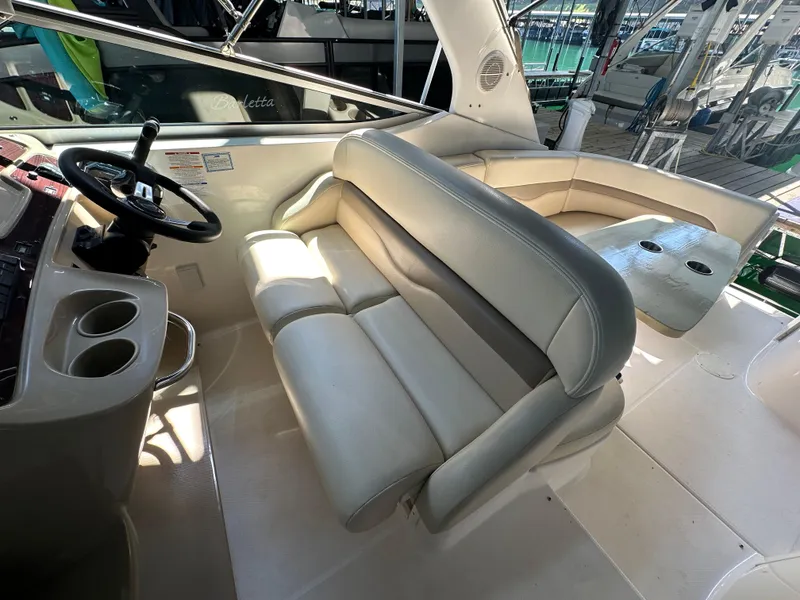 Slide: The Image of 2004 Chaparral Signature 330 boat interior with seating and steering wheel. - 10