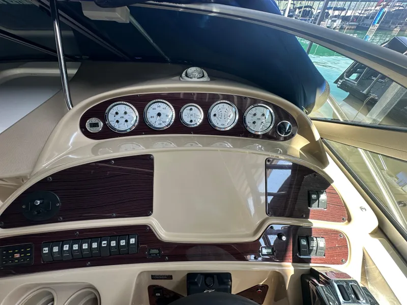 Slide: The Image of Dashboard of a 2004 Chaparral Signature 330 boat with gauges and controls. - 11