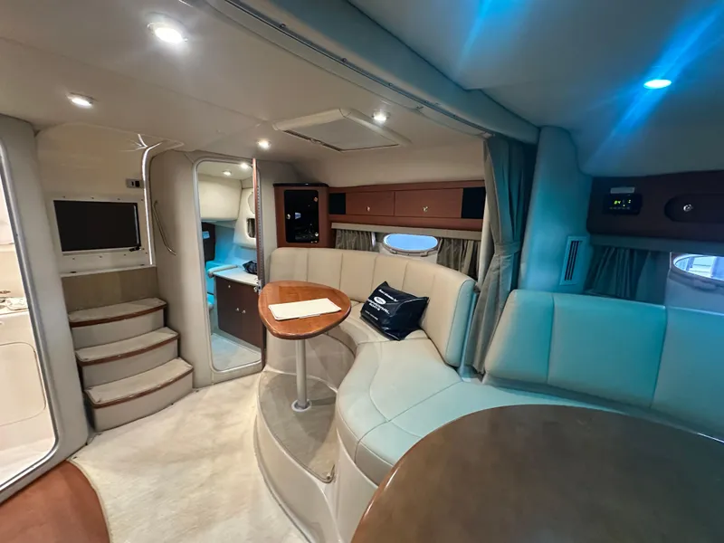 Slide: The Image of Interior of 2004 Chaparral Signature 330 yacht with seating and table. - 15