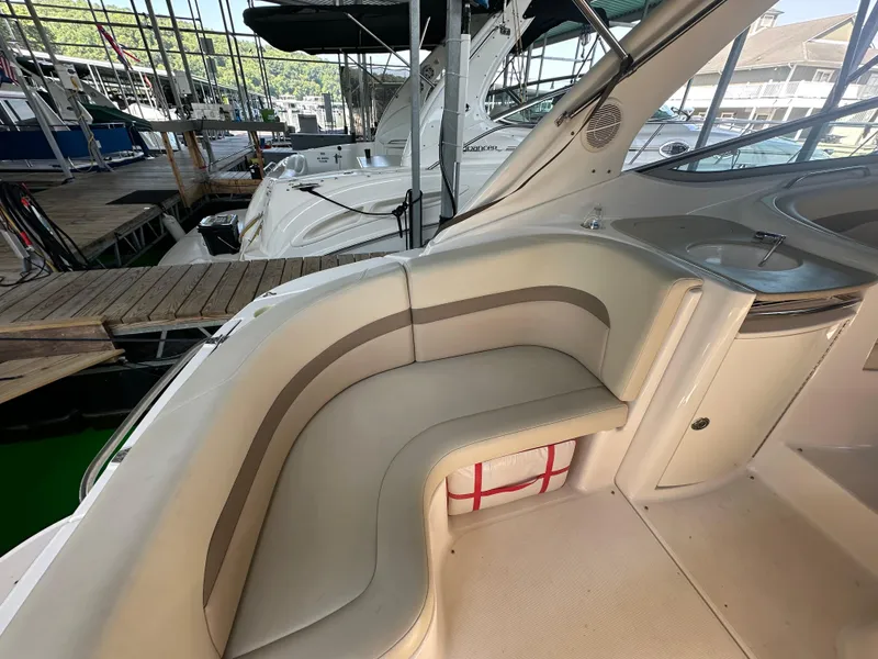 Slide: The Image of 2004 Chaparral Signature 330 boat interior with seating and dock view. - 6