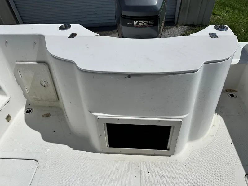 Slide: The Image of 2001 Sailfish 234 WAC boat interior with Yamaha V225 outboard motor. - 15