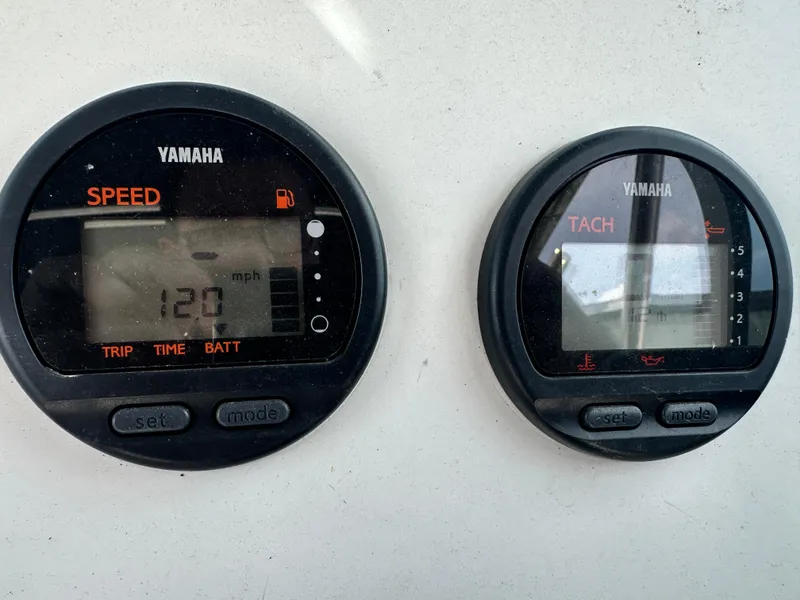 Slide: The Image of Yamaha speedometer and tachometer on 2001 Sailfish 234 WAC boat dashboard. - 17