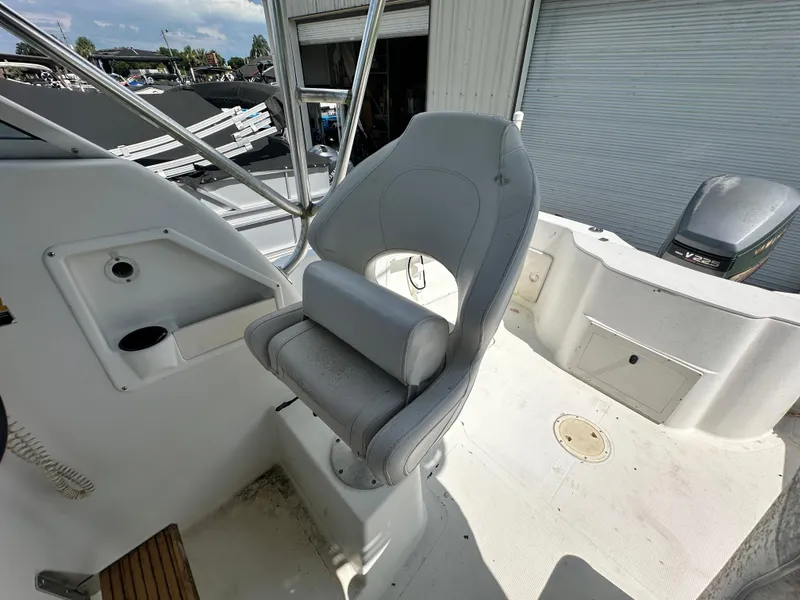 Slide: The Image of 2001 Sailfish 234 WAC boat interior with captain's chair and control panel. - 21