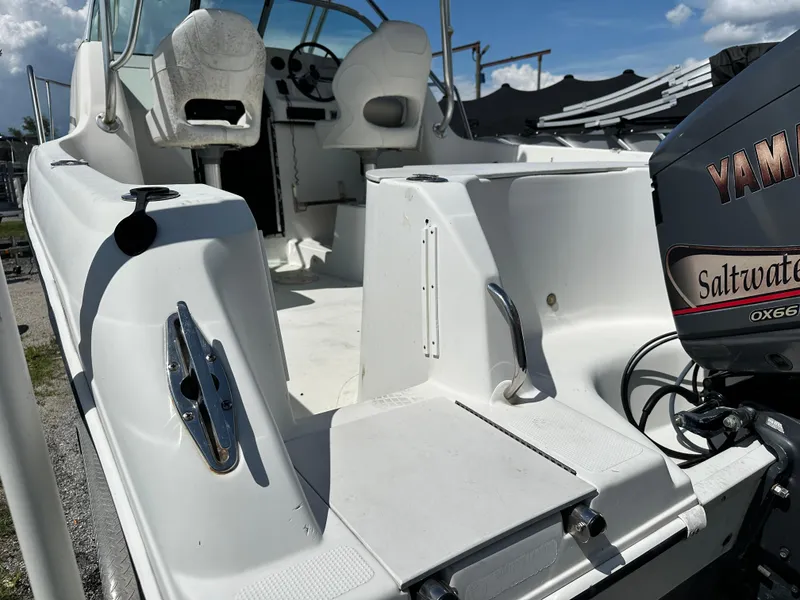 Slide: The Image of 2001 Sailfish 234 WAC boat interior with Yamaha Saltwater engine, sunny day. - 3