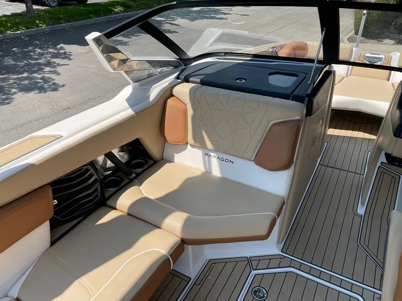 Slide: The Image of 2021 Nautique Super Air Nautique G23 Paragon interior with tan seating and sleek design. - 10
