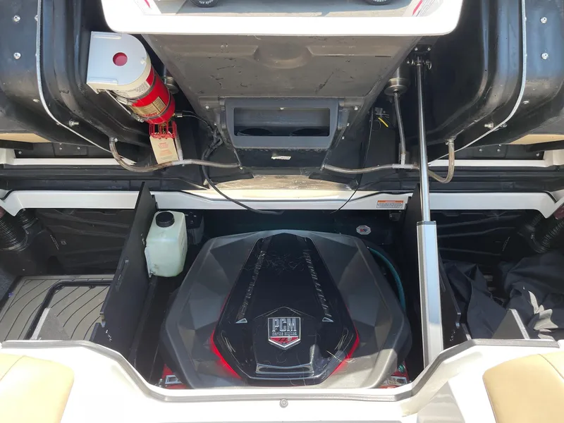 Slide: The Image of 2021 Nautique Super Air Nautique G23 Paragon engine compartment with PCM engine and fire extinguisher. - 14