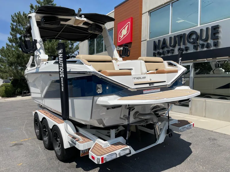 Slide: The Image of 2021 Nautique Super Air Nautique G23 Paragon boat at dealership, rear view. - 3