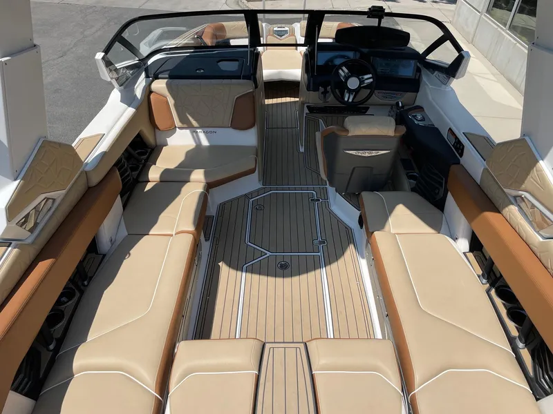 Slide: The Image of 2021 Nautique Super Air Nautique G23 Paragon interior with tan seating and sleek design. - 5