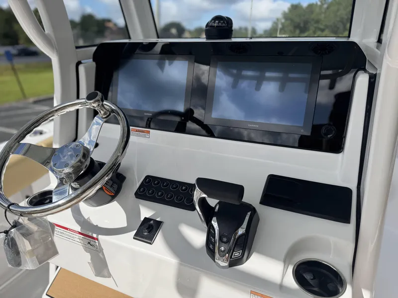 Slide: The Image of 2026 Sportsman Heritage 231 Center Console dashboard with steering wheel and dual displays. - 14