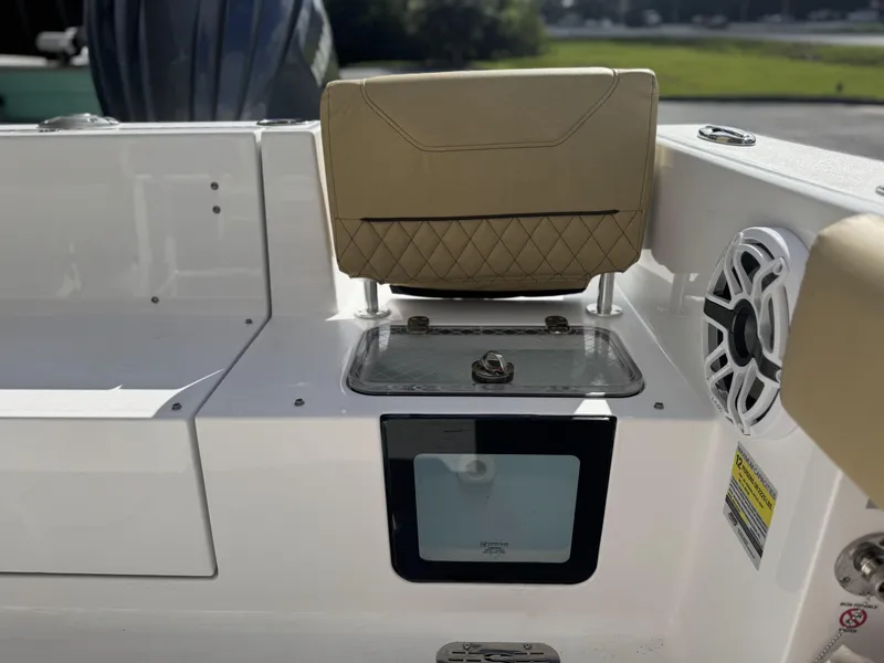 Slide: The Image of 2026 Sportsman Heritage 231 Center Console boat interior with seating and speaker. - 17