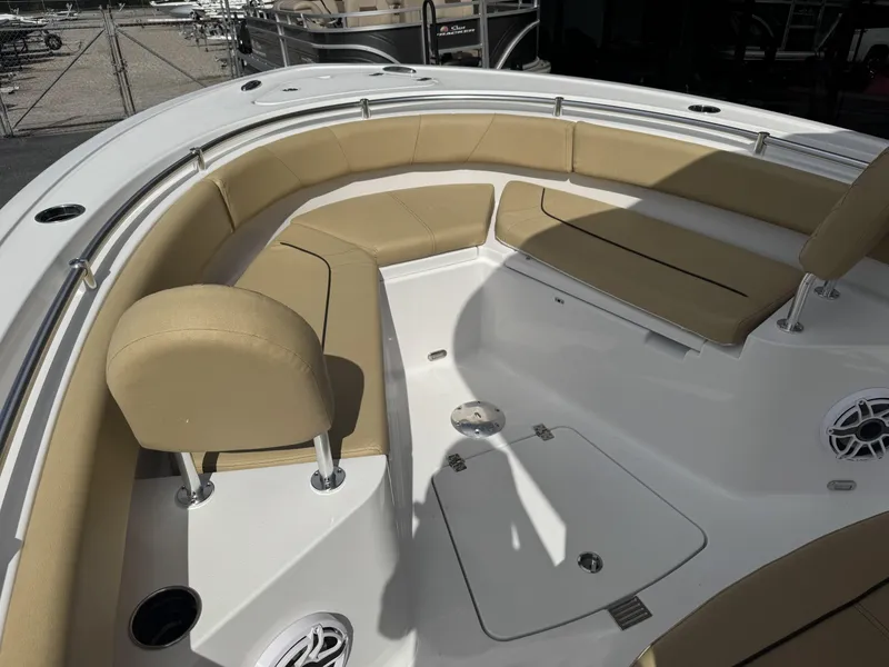 Slide: The Image of 2026 Sportsman Heritage 231 Center Console boat with tan seating and spacious deck. - 20