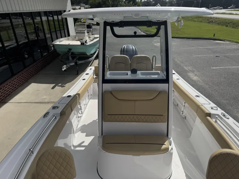 Slide: The Image of 2026 Sportsman Heritage 231 Center Console boat with tan seating and modern design. - 21