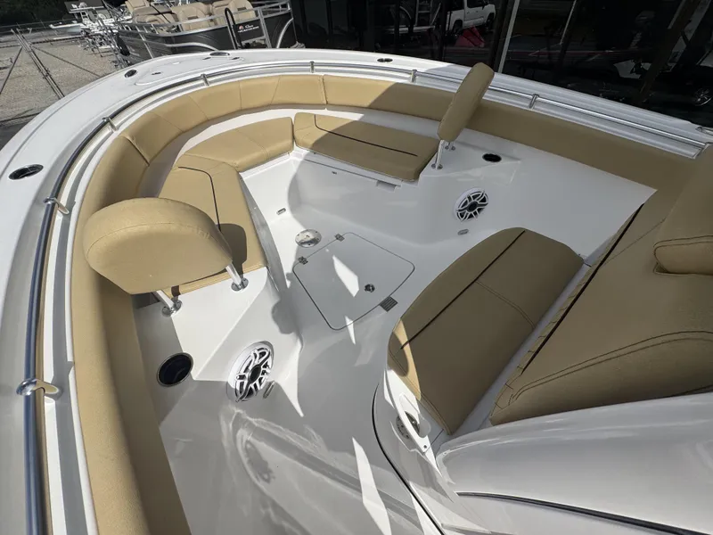 Slide: The Image of 2026 Sportsman Heritage 231 Center Console boat with tan seating and modern design. - 23