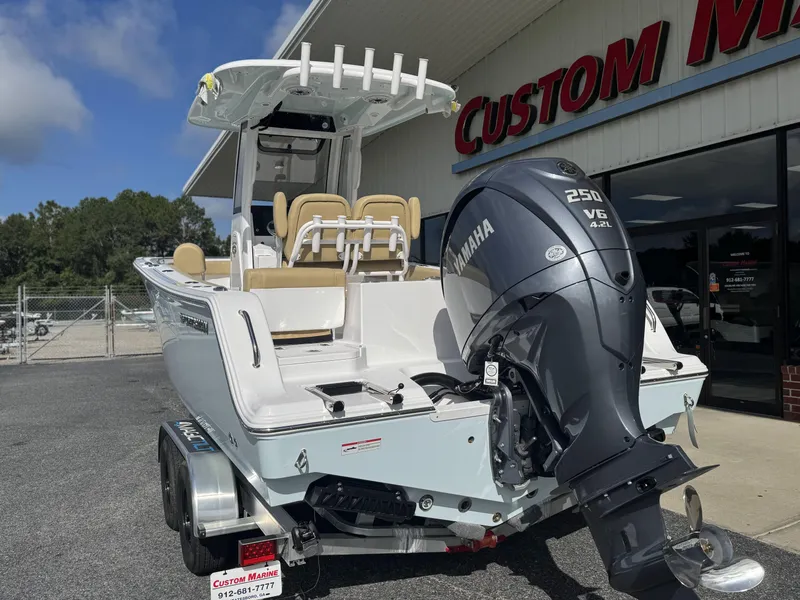 Slide: The Image of 2026 Sportsman Heritage 231 Center Console boat with Yamaha 250 V6 engine at dealership. - 5