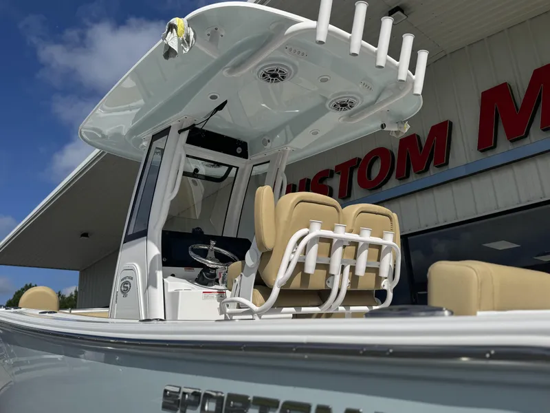 Slide: The Image of 2026 Sportsman Heritage 231 Center Console boat at dealership, showcasing seating and console features. - 7