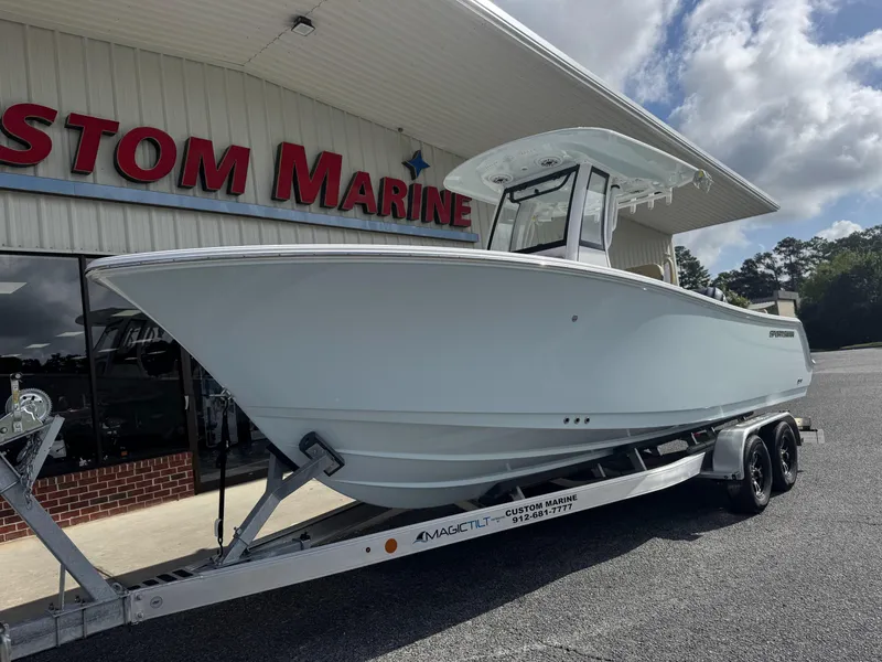 Slide: The Image of 2026 Sportsman Heritage 231 Center Console boat on trailer at Custom Marine dealership. - 9