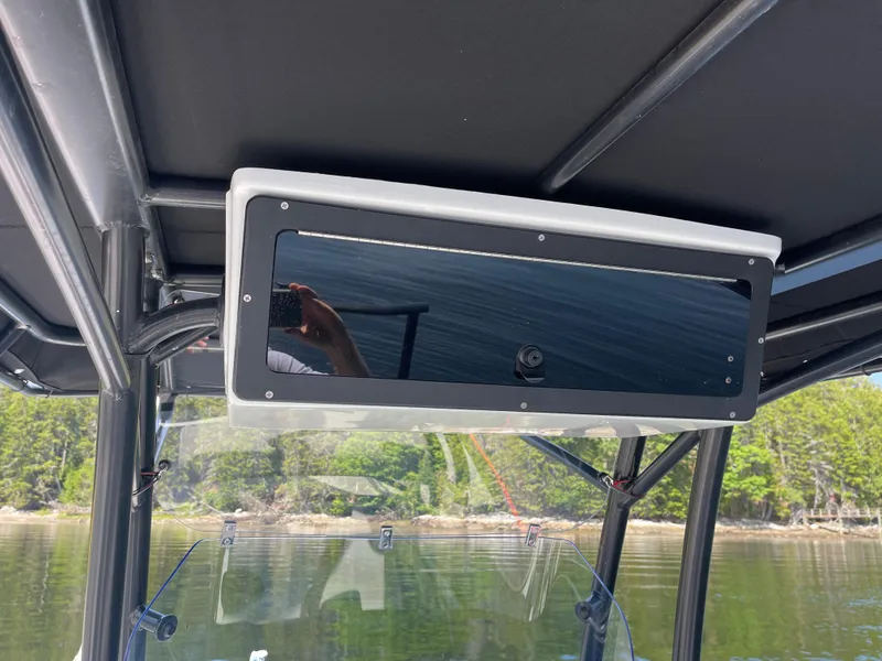 Slide: The Image of 2022 Zodiac Open 7 boat interior with mounted black panel and scenic water view. - 18