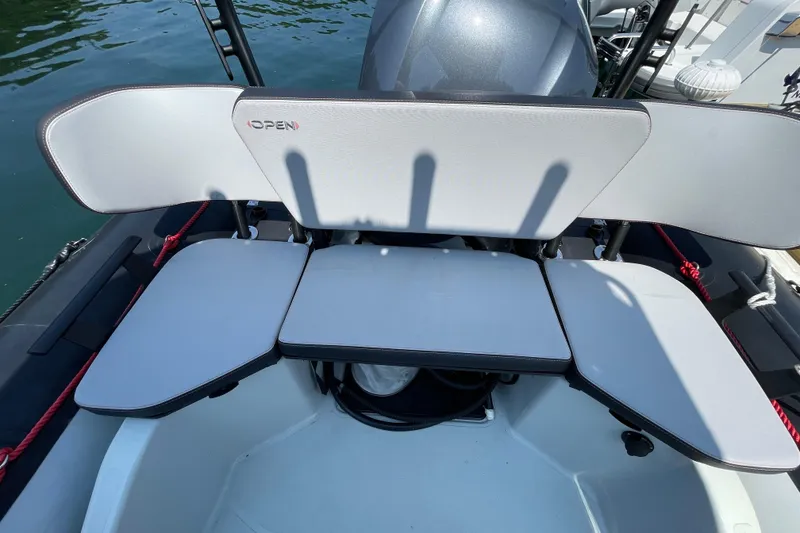 Slide: The Image of 2022 Zodiac Open 7 boat seating area with gray cushions and backrest. - 27