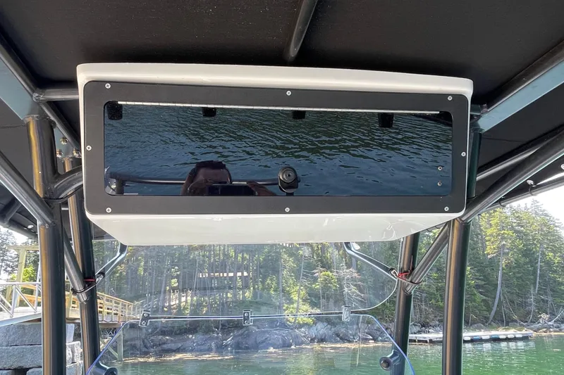 Slide: The Image of 2022 Zodiac Open 7 boat interior with overhead storage compartment. - 33