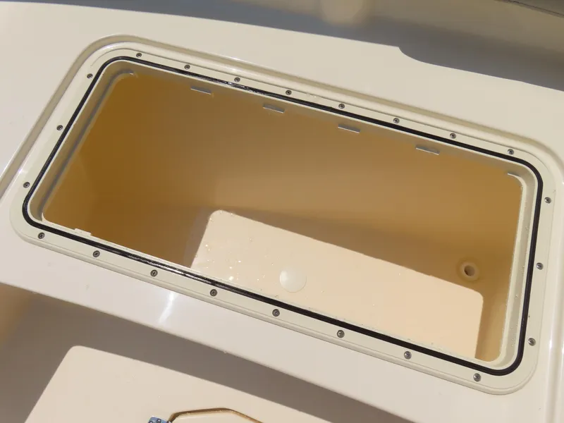 Slide: The Image of Storage compartment on 2022 Scout 255 Dorado boat, featuring a sleek, durable design. - 13