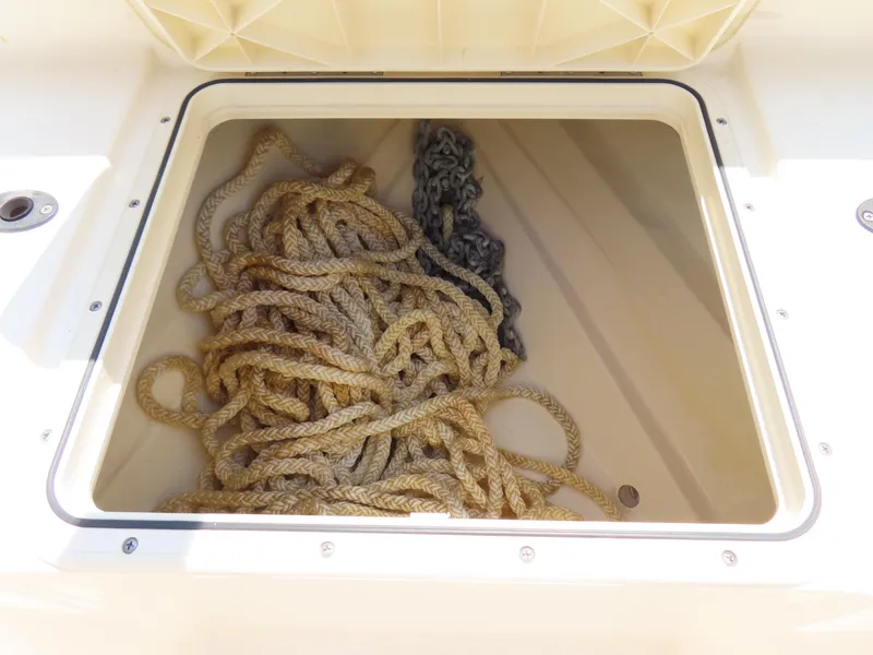 Slide: The Image of Rope storage compartment on 2022 Scout 255 Dorado boat. - 15