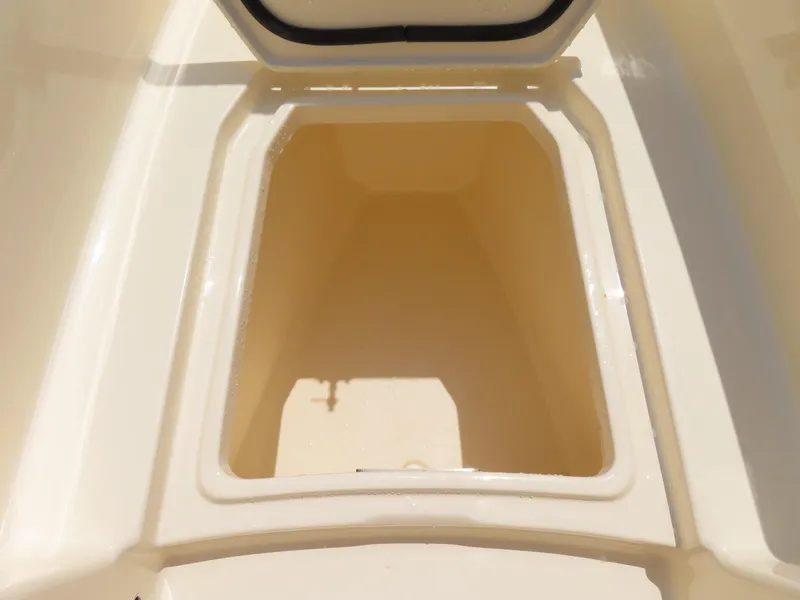 Slide: The Image of 2022 Scout 255 Dorado storage compartment, open and empty, showcasing interior space. - 17