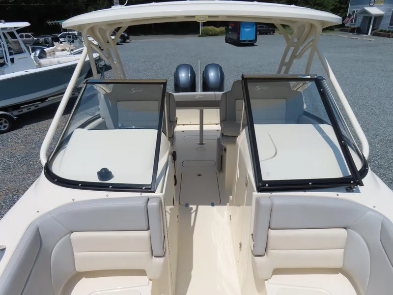 Slide: The Image of 2022 Scout 255 Dorado boat interior with dual consoles and seating. - 20