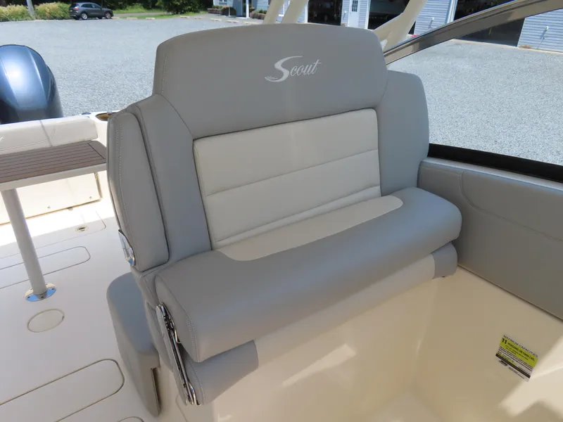 Slide: The Image of 2022 Scout 255 Dorado boat seat with gray and white upholstery. - 22