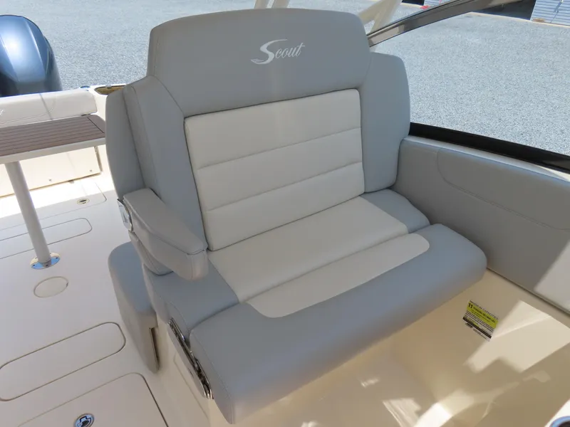 Slide: The Image of 2022 Scout 255 Dorado boat seat with gray and white upholstery. - 23