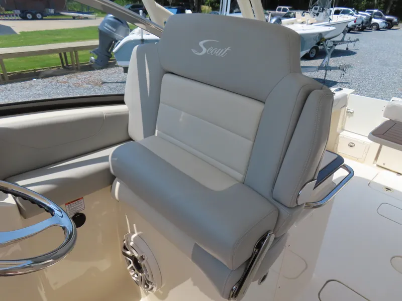Slide: The Image of 2022 Scout 255 Dorado boat seat with steering wheel, showcasing luxury design. - 30