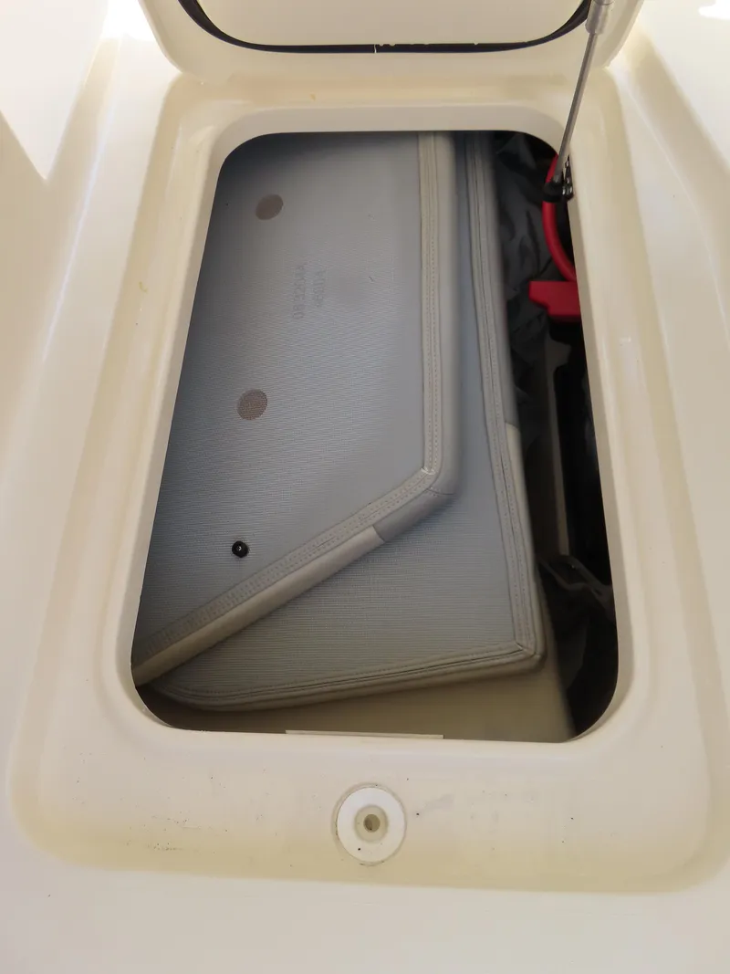 Slide: The Image of Storage compartment of 2022 Scout 255 Dorado boat, showing interior details. - 36