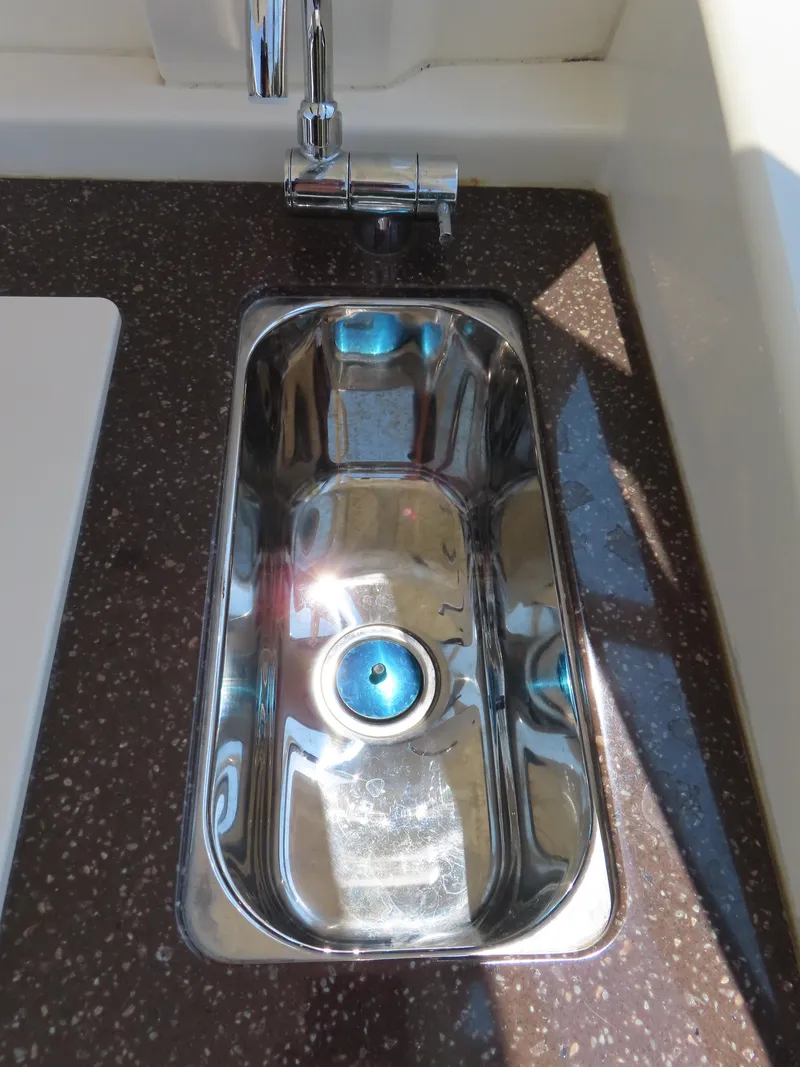 Slide: The Image of Stainless steel sink on 2022 Scout 255 Dorado boat with modern faucet. - 38