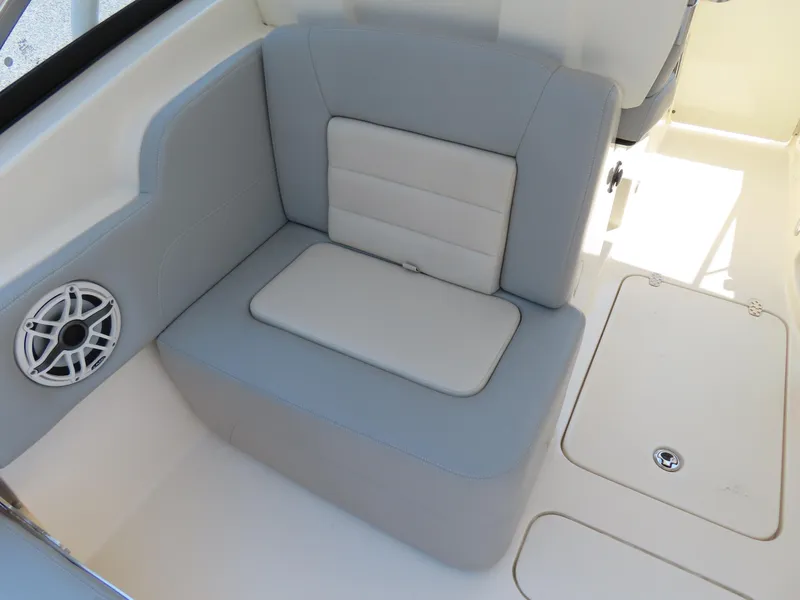 Slide: The Image of 2022 Scout 255 Dorado boat interior with cushioned seating and speaker. - 39