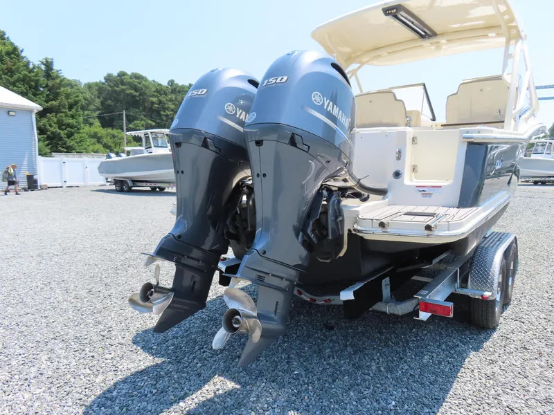 Slide: The Image of 2022 Scout 255 Dorado boat with dual Yamaha 150 outboard engines on a trailer. - 4