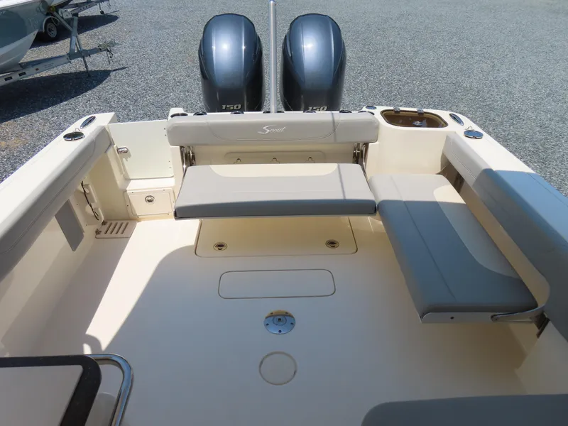 Slide: The Image of 2022 Scout 255 Dorado boat interior with seating and dual engines. - 42