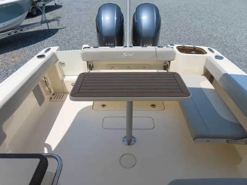 Slide: The Image of 2022 Scout 255 Dorado boat interior with table and seating arrangement. - 43