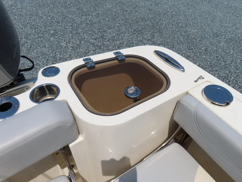 Slide: The Image of 2022 Scout 255 Dorado boat interior with storage compartment and seating. - 44