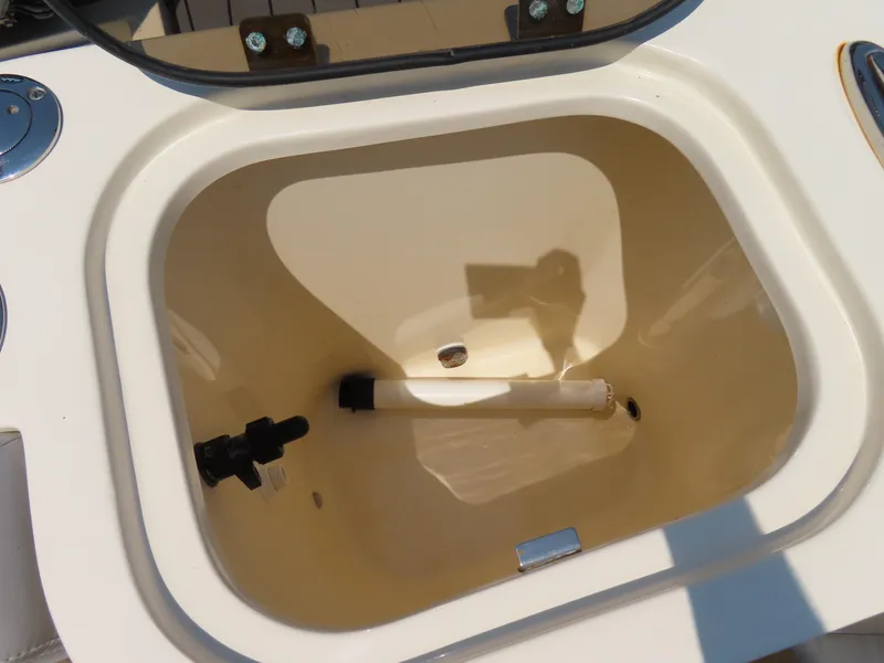 Slide: The Image of 2022 Scout 255 Dorado boat livewell with open lid and plumbing fixtures. - 45