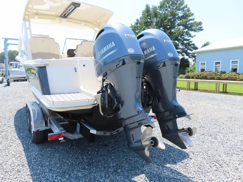 Slide: The Image of 2022 Scout 255 Dorado boat with dual Yamaha 150 engines on a trailer. - 5
