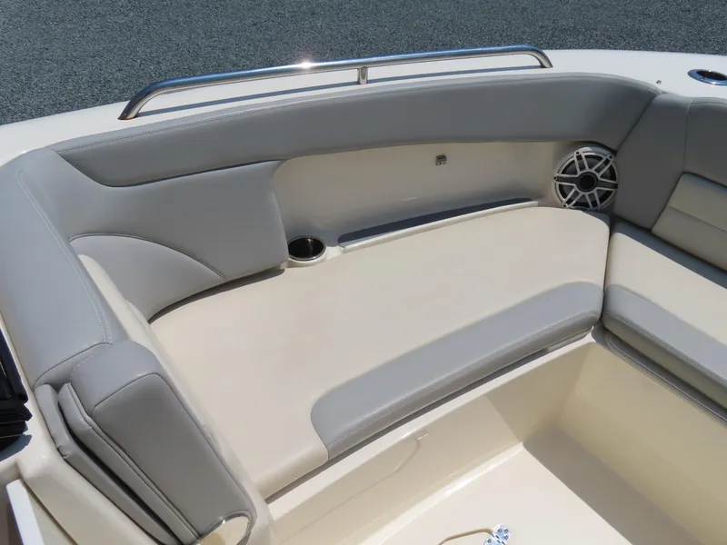Slide: The Image of 2022 Scout 255 Dorado boat interior with cushioned seating and speaker. - 8