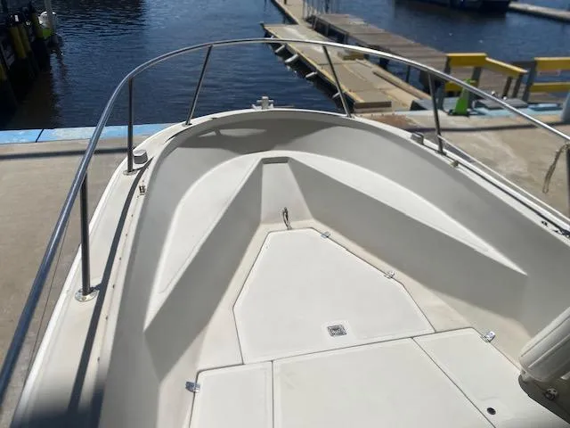 Slide: The Image of 1989 Boston Whaler 20 Outrage boat dashboard with steering wheel and navigation equipment. - 11