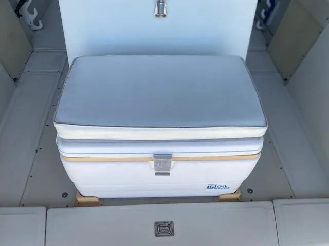 Slide: The Image of 1989 Boston Whaler 20 Outrage boat interior with seating and steering console. - 13