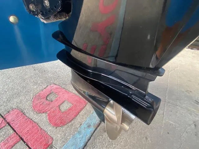 Slide: The Image of Propeller of a 1989 Boston Whaler 20 Outrage boat, close-up view. - 31