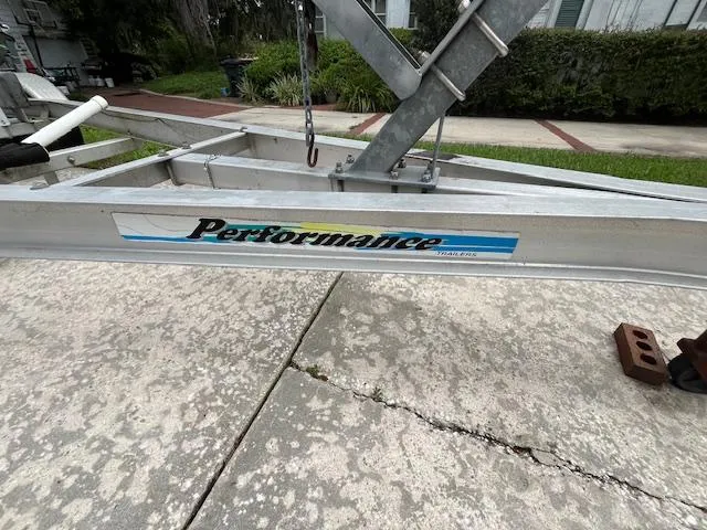 Slide: The Image of 1989 Boston Whaler 21 Outrage boat with Mercury outboard motor at dockside. - 7