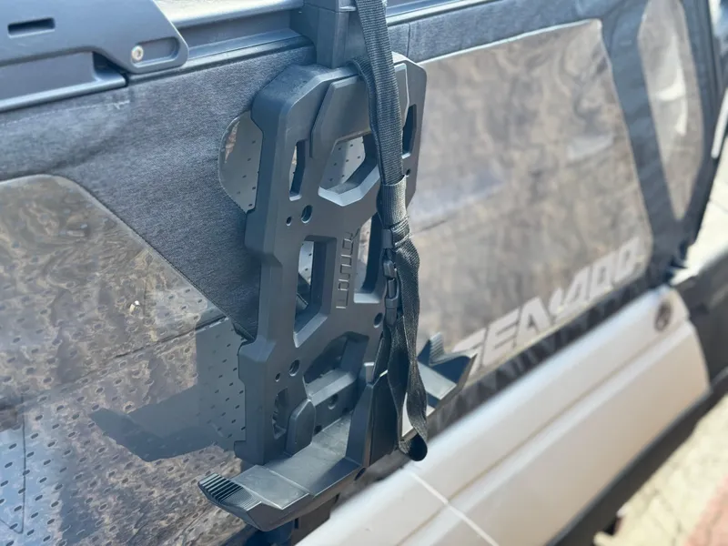 Slide: The Image of 2023 Sea-Doo Switch Sport 18 with mounted accessory bracket and visible branding. - 10