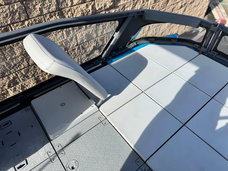 Slide: The Image of 2023 Sea-Doo Switch Sport 18 interior with modular seating and textured flooring. - 13