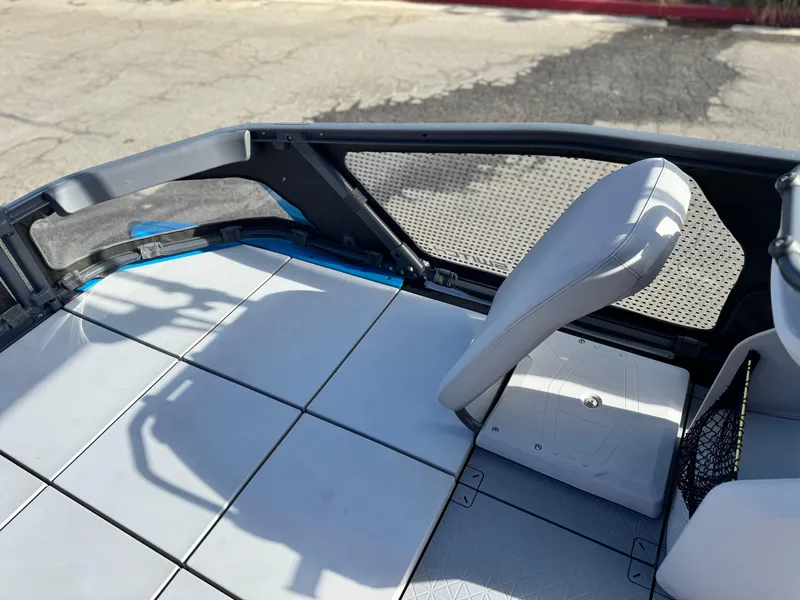 Slide: The Image of 2023 Sea-Doo Switch Sport 18 interior with seating and deck details. - 14