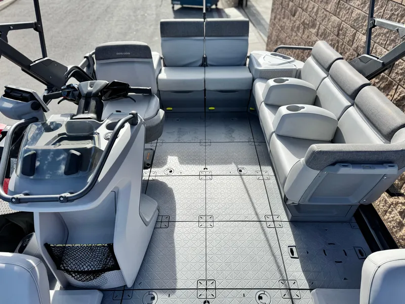 Slide: The Image of 2023 Sea-Doo Switch Sport 18 interior with seating and steering console. - 15