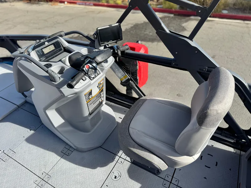 Slide: The Image of 2023 Sea-Doo Switch Sport 18 cockpit with steering wheel and seat, showcasing modern design. - 19